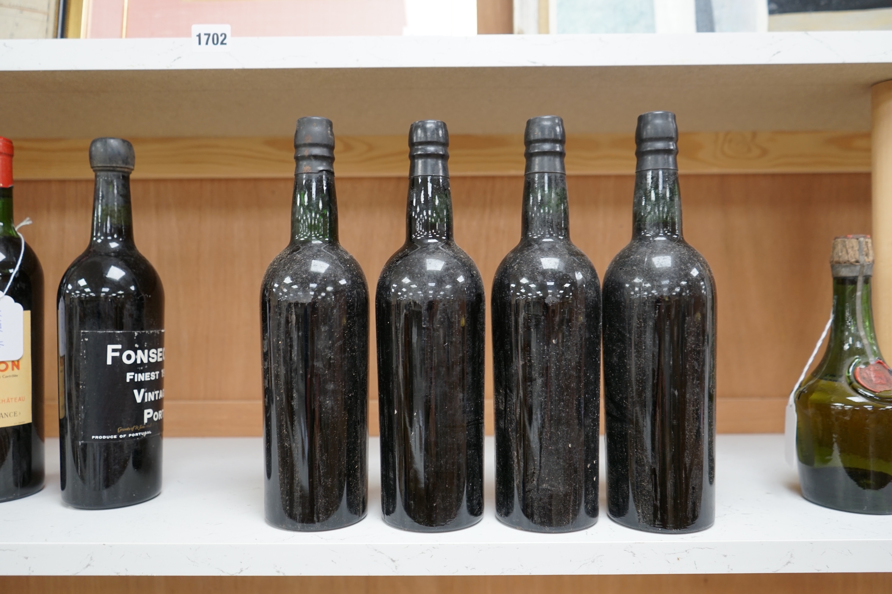 Four bottles of Cockburn’s 1963 vintage port. Condition fair, some wear to labels.